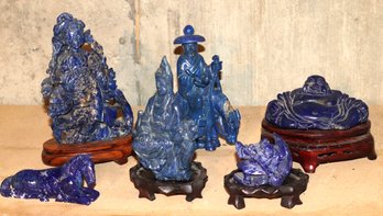 Lot Of 7 Chinese Lapis Lazuli Figures Some On Wood Stands Including Buddhas, And Animals