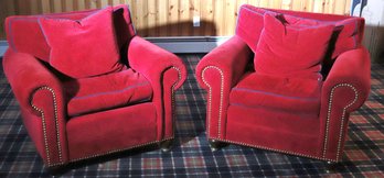 Pair Of Cozy Cranberry Toned Custom Corduroy Chairs With Blue Piping Along The Edges And Nail Head Accents