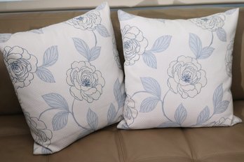 Pair Of Accent Pillows With White Textured Background & Large Light Blue Flowers.