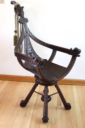 Mahogany Victorian Style Curule Saddle Seat Arm Chair With Carved Figural Serpent Head Accents