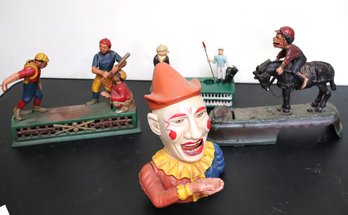 Collection Of Cast Metal Coin Banks Include Book Of Knowledge, Jockey On Mule, Clown, Batter And More.