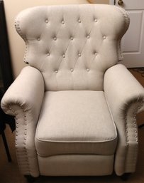 Recliner Chair With A Modern Neutral Toned Fabric And Nail Head Accents