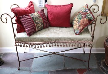 Gilded Iron Bench With Curved Design And Upholstered Seat.