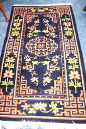 Vintage Hand-woven Area Rug With A Bright Orange Floral Pattern Measures Approximately 66 Inches X 36 Inch