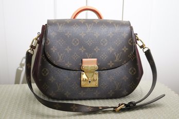 Authentic Louis Vuitton Monogram Eden Handbag With Strap And Burgundy Leather Sides.