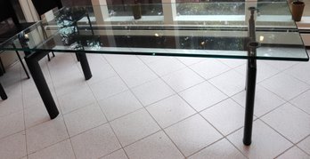 Contemporary Glass Top Dining Table With Tubular Black Metal Legs