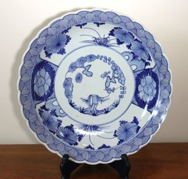 Japanese Blue And White Porcelain Charger With Blue Circle Marks On The Underside.