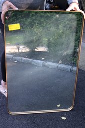 Modern Wall Mirror.Measures Approximately 24 W X 36 Tall. Gold/Brass Toned As Pictured, Like New With Box.