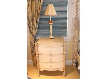 French Style Fluted Front Leg 3 Drawer Side Table With Faux Finish With A Candlestick Lamp