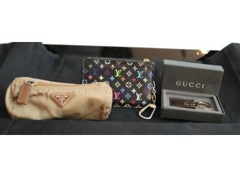 Assorted Women's Lot With Louis Vuitton Change Purse, Gucci Key Ring And Prada Nylon Makeup Case