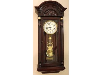 Howard Miller Jennison Mahogany Triple Chime Wall Clock With Brass Pendulum And Key.