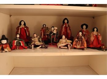 BEAUTIFUL COLLECTION OF ASIAN PORCELAIN DOLLS IN TRADITIONAL OUTFITS