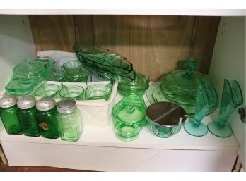 COLLECTION OF GREEN DEPRESSION GLASS INCLUDES SERVING DISHES, SHAKERS, SUGAR BOWL & SPICE JARS