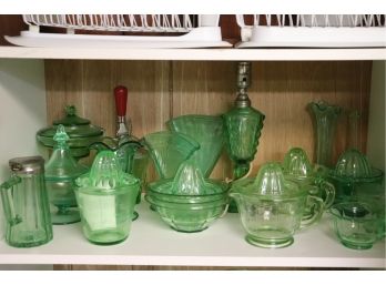 LARGE COLLECTION OF GREEN DEPRESSION GLASS INCLUDES JUICERS, CANDY DISHES LAMP & SYRUP JAR