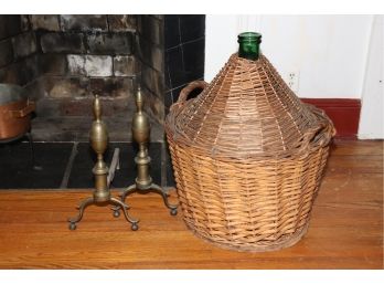 PAIR OF VINTAGE BRASS ANDIRONS & GREEN WINE BOTTLE ENCASED IN A WICKER BASKET