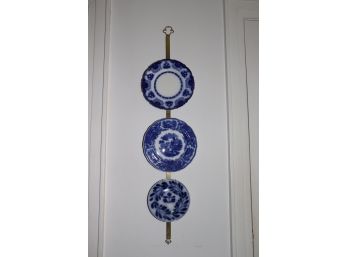 COLLECTION OF 3 FLOW BLUE DECORATIVE WALL PLATES WITH BRASS HANGER