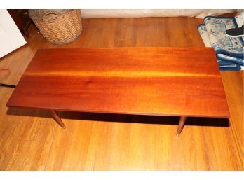 MID CENTURY MODERN WOOD COFFEE TABLE WITH TAPERED LEGS AND GOLD METAL FEET