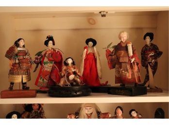 COLLECTION OF ASIAN PORCELAIN DOLLS IN TRADITIONAL OUTFITS