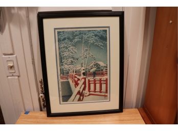 JAPANESE WOODBLOCK PRINT OF ANCIENT VILLAGE WITH LADY AND UMBRELLA IN WINTERS SNOW