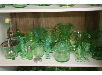 LARGE COLLECTION OF GREEN DEPRESSION GLASS INCLUDES SORBET DISHES, SALT & PEPPER, AND CANDY DISHES