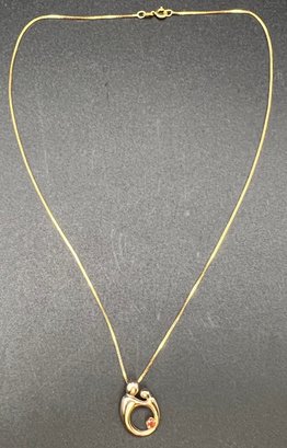 14KT Gold Mother Child Garnet Pendant On 14K Chain Necklace
