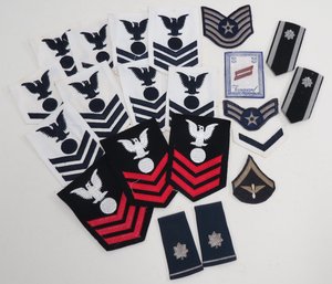 Collection Of Military Patches And Pins