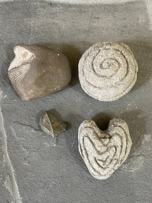 Grouping Of Fossils And Carved Stones