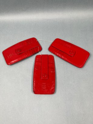 3 Red Leather Tusk Credit Card Holders.