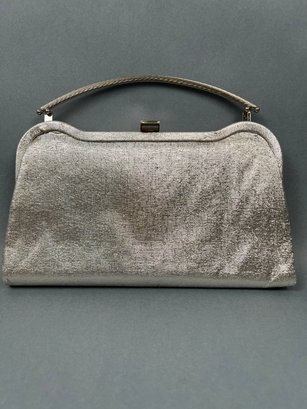 Silver Clutch With Silver Rope Handle.