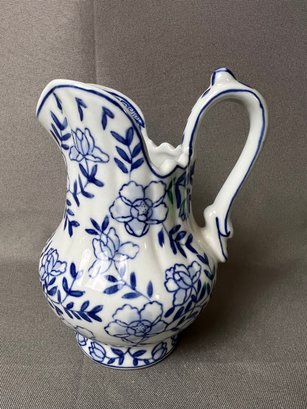 Blue And White Floral Design Pitcher.