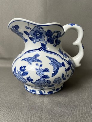 Blue And White Floral Pitcher.