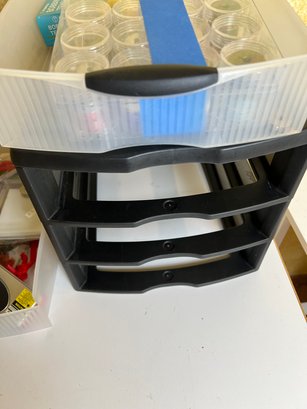 Small Set Of Plastic Drawers Filled With Sewing Supplies.
