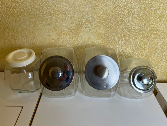 4 Glass Counter Top Containers.