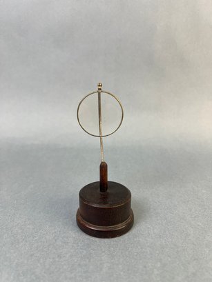 Vintage Magnifying Glass On A Wood Stand.