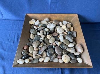 Copper Colored Dish With Polished Stones.