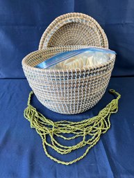 Large Covered Wicker Basket With Seashells And A Green Bead Necklace.