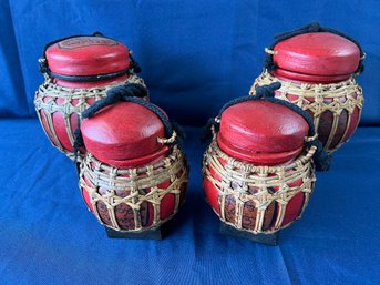 4 Wood And Wicker Covered Urns.