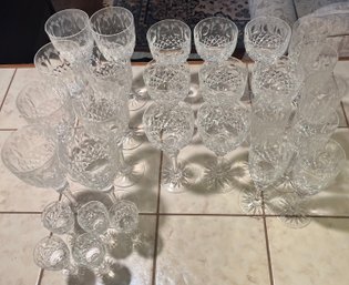 28 Crystal Glasses - 8 Large Wine Goblets, 5 Sherry, 8 Small Wine Goblets, 7 Champagne Flutes.