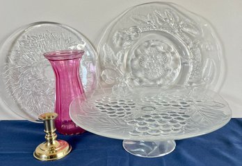 2 Glass Platters, 1 Pedestal Platter, Vase, And A Brass Candleholder.