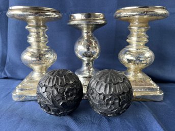 3 Large Chromed Glass Candleholders And 2 Carved Wood Balls.