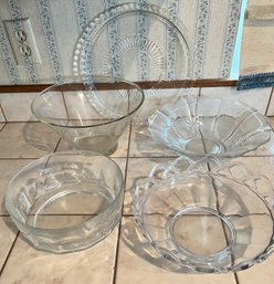4 Glass Bowls And A Glass Platter.