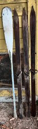 3 Vintage Skis With Leather Bindings And Old Paddle