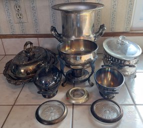 9 Silver Plate Items Ice Bucket, Chafer, Casserole, Covered Server And Other Items.