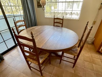 Round Table & 4 Ladder Back Chairs With Rush Seats.