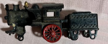 3 Cast Iron Toys, 2 Train Engines And A Farmer On His Tractor.