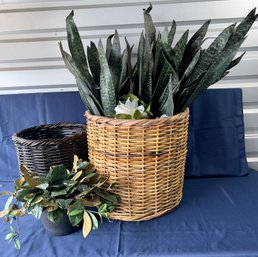 2 Large Baskets And One Clay Pot With Faux Flora.