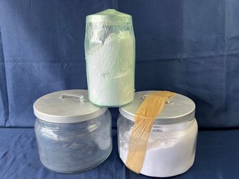 3 Covered Glass Containers, 2 With Laundry Detergent.