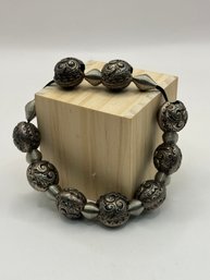 Silver Tone Metal Balls On Stretchy Band