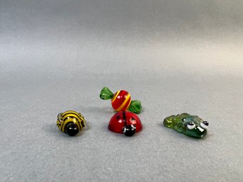3 Miniature Glass Critters And A Piece Of Candy.
