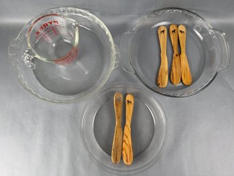 3 Glass Pie Pans A Measuring Cup And 5 Wood Animal Motif Mixing Spoons.